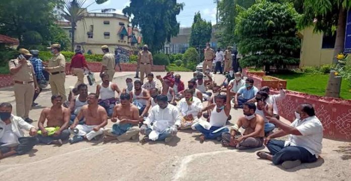Leading travel operators of Telangana State held 'shirtless protest' at Regional Transport Authority (RTA) Headquarters, Khairtabad here on Monday demanding waiver of Motor Vehicle Tax for the lockdown
