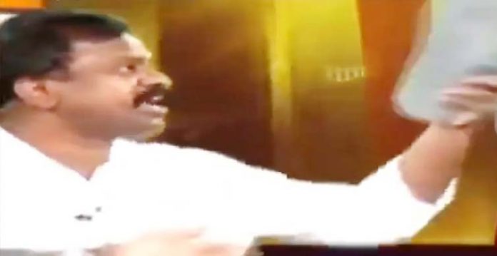 amaravati activist hits c with slipper during tv debate