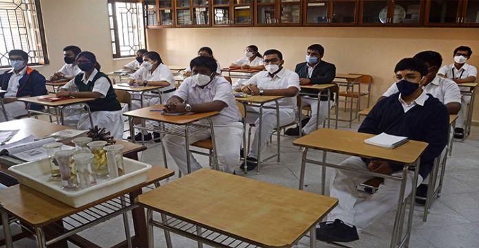 amid covid, andhra pradesh suspends classes for 1 to 9 standards]
