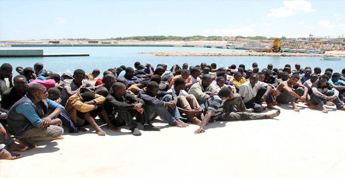 over 2,000 migrants reach mediterranean island by boat