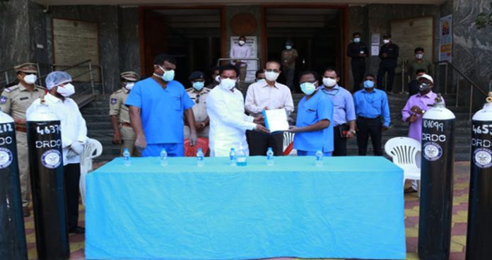 union minister kishan reddy hands over oxygen cylinders to gandhi hospital