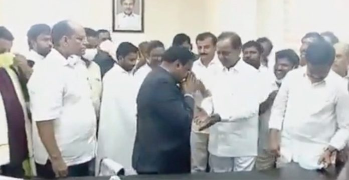 collector draws ire for touching telangana cm's feet