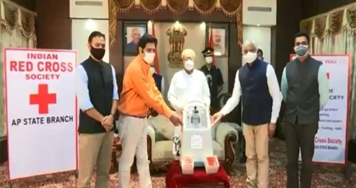 andhra pradesh governor hands over medical equipment to red cross society