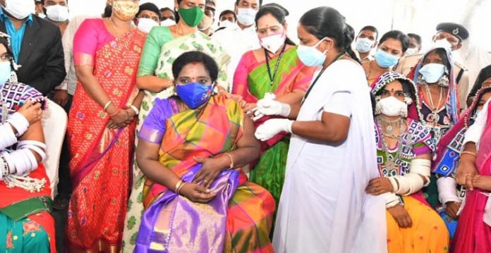 governor creates history by taking vaccine in a tribal habitation in telangana state