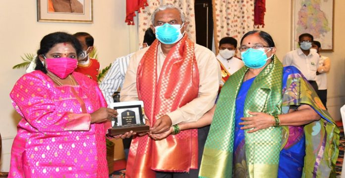 governor felicitates ‘road doctor’ gangadhar tilak at raj bhavan