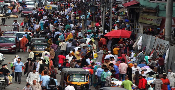 rain plays spoilsport as kashmiris throng markets on eid eve