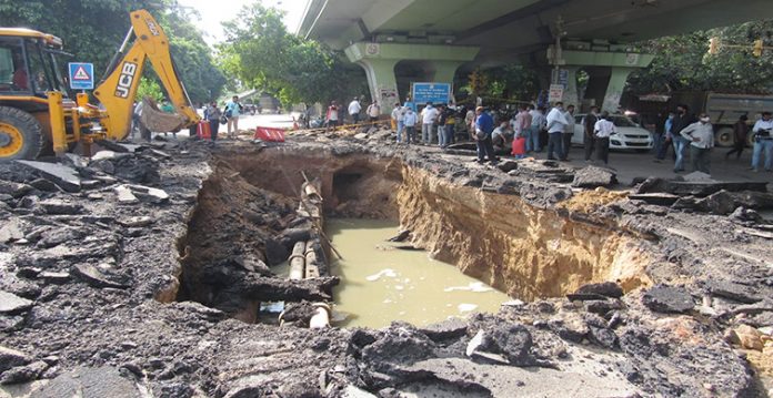 road collapses under iit flyover after heavy rain in delhi