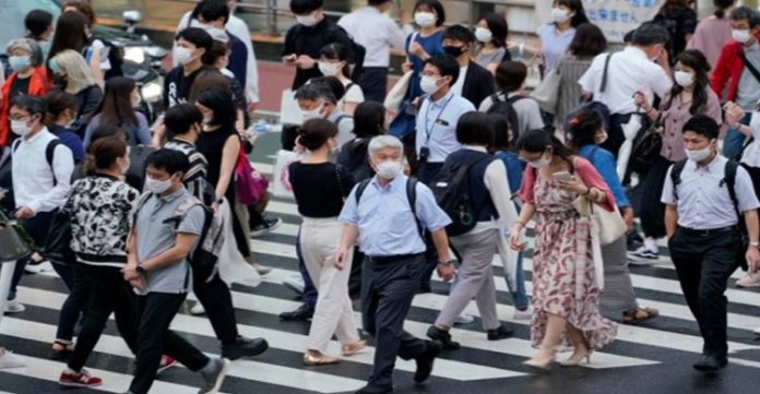 Japan not to tighten Covid-19 curbs despite Omicron community spread