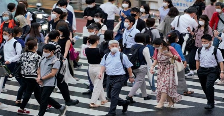 Japan not to tighten Covid-19 curbs despite Omicron community spread