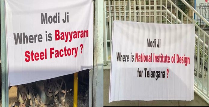trs banners with 17 questions greet modi in hyderabad