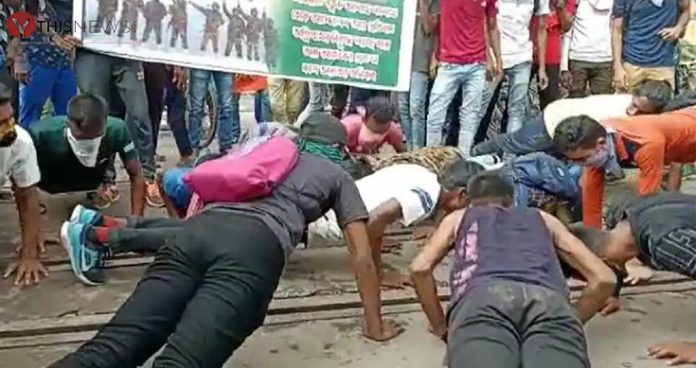 anti agnipath protesters do push ups on railway tracks in bengal