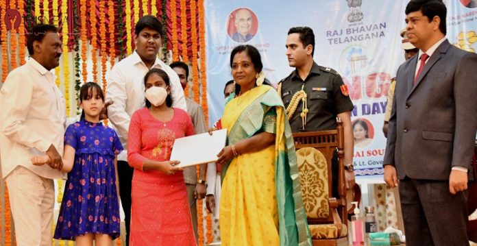 ts formation day celebrated at raj bhavan; guv distributes laptops to needy students