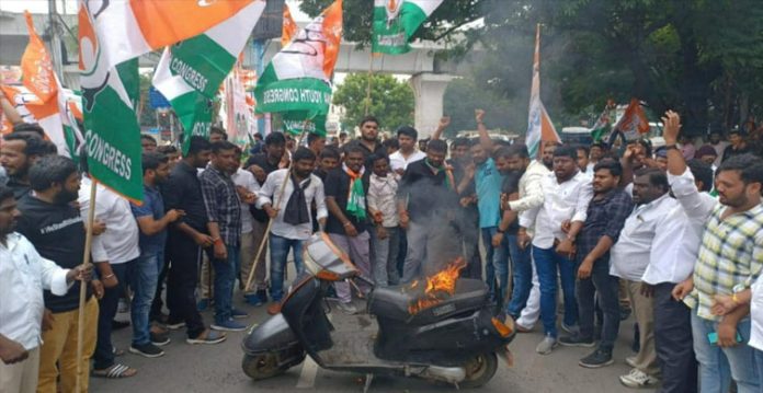 hyderabad youth congress workers set scooter ablaze during protest at ed office