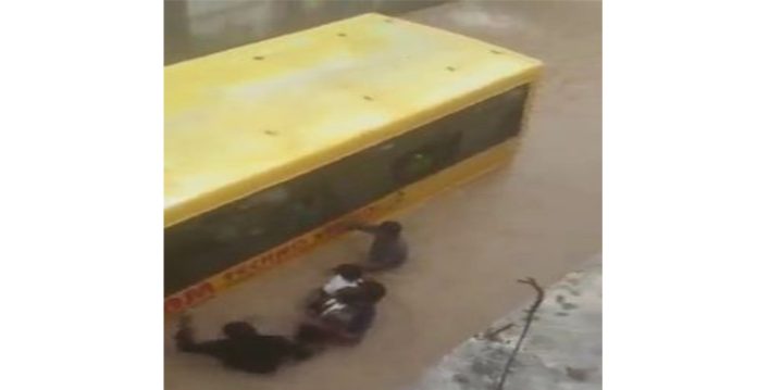 telangana schoolchildren rescued after bus trapped in flood water