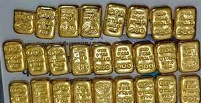 1.9 kg gold seized from eight passengers at hyderabad airport
